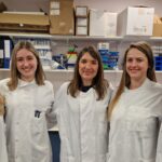 Photo taken in Biorepository, featuring biorepository team members Natalia Piaszczyk and Lydia Moore, as well as Dr Maura Malpetti and BBC Look East reporter Nikki Fox.