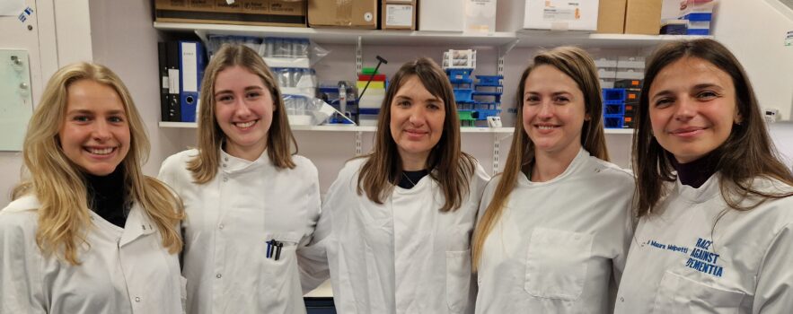 Photo taken in Biorepository, featuring biorepository team members Natalia Piaszczyk and Lydia Moore, as well as Dr Maura Malpetti and BBC Look East reporter Nikki Fox.